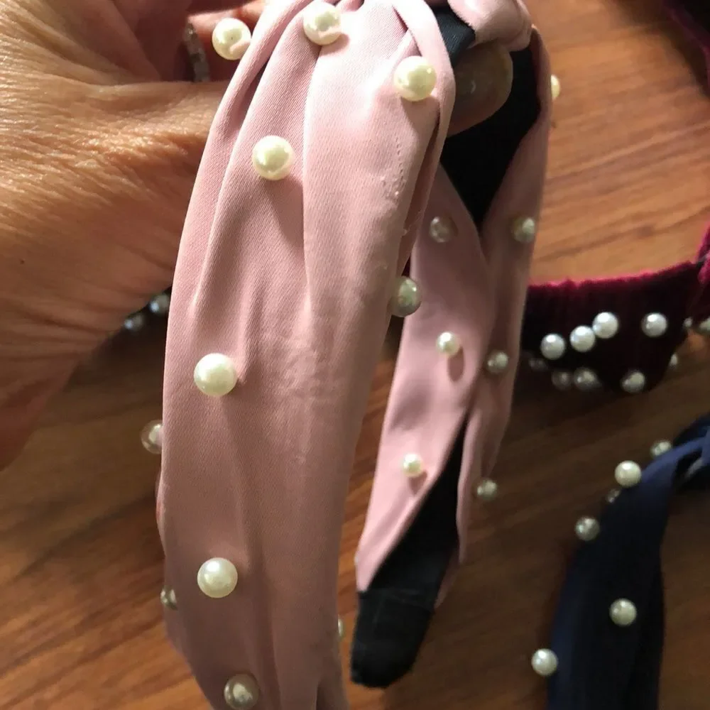 lot of pearl headbands. Velvet and chiffon.